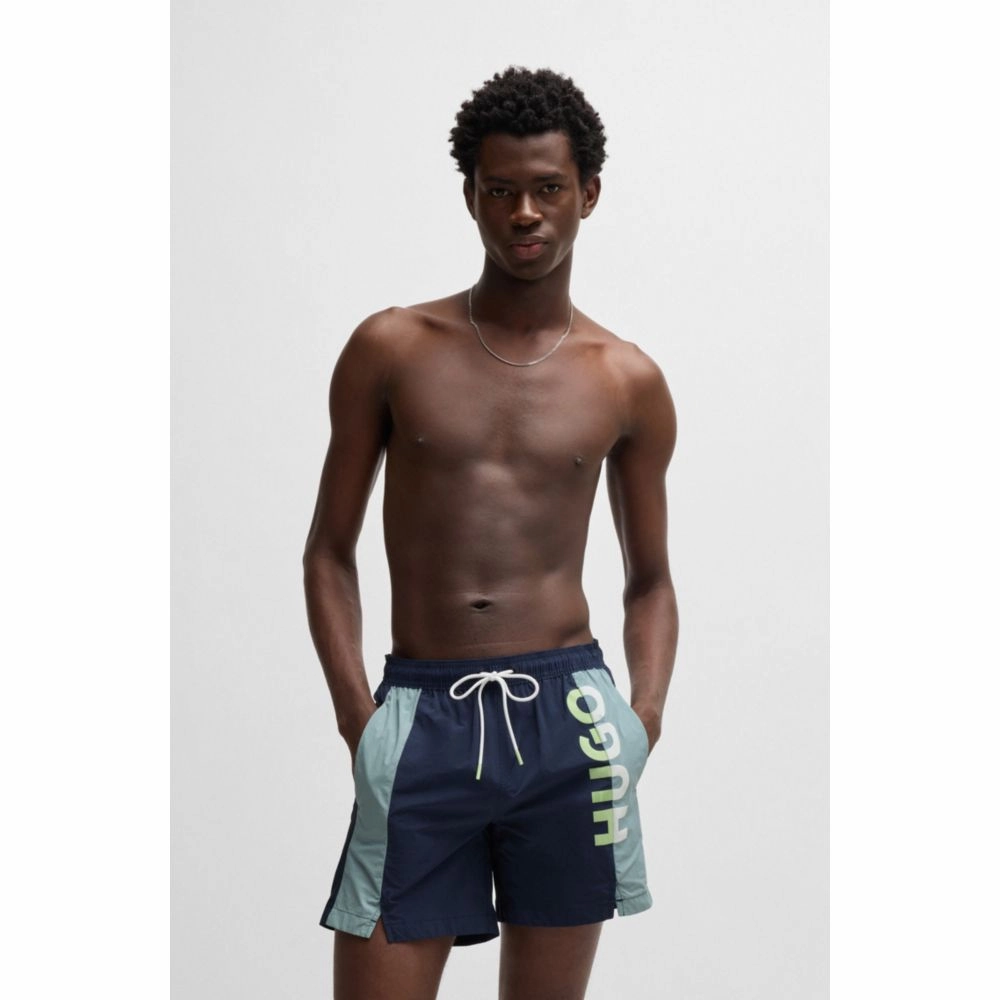 Color-blocked swim shorts with two-tone logo