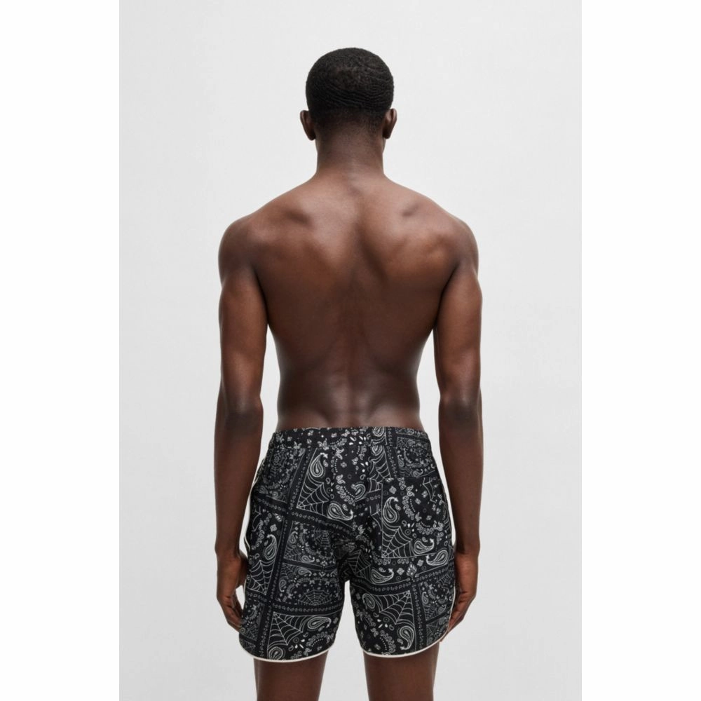 Seasonal-print swim shorts with round hem