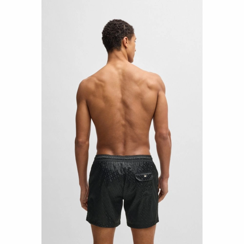 Swim shorts with all-over tonal monograms