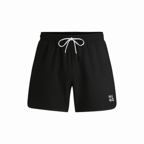 Waffle-structured swim shorts with embroidered stacked logo